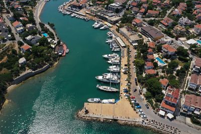 High angle view of marina and buildings in city