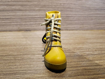 High angle view of yellow boot on table