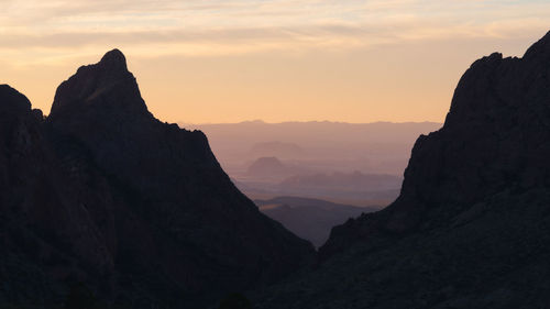 Scenic view of silhouette mountains against sky during sunset in big bend national park - texas