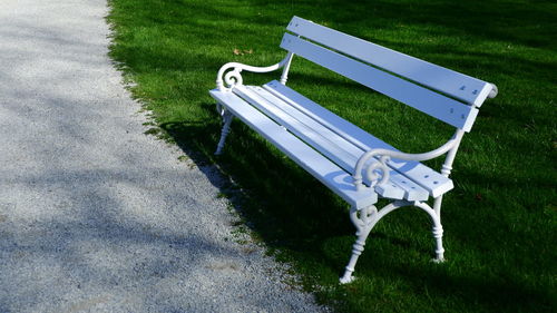 High angle view of empty bench in park