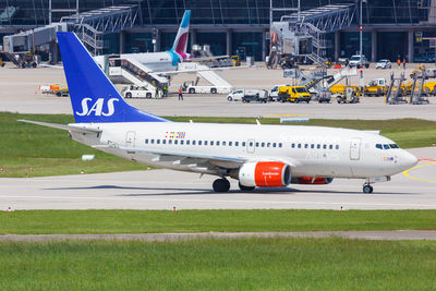 View of airplane at airport runway