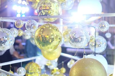 Illuminated disco balls at night