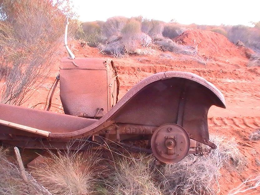 ABANDONED TRUCK ON FIELD