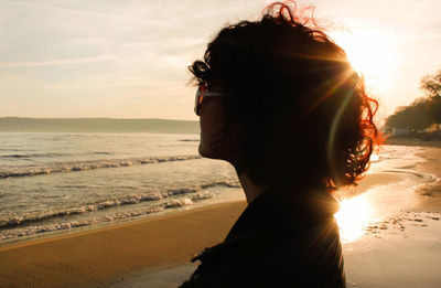 Portrait of woman on beach during sunset