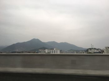 Scenic view of mountains against sky at dusk