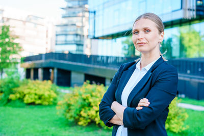 Happy business woman with professional appearance smiling confidently in city