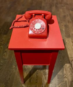 Close-up of telephone on table