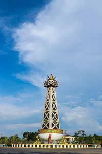 Low angle view of tower against cloudy sky