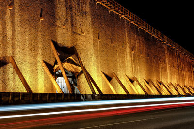 Light trails on road in city at night