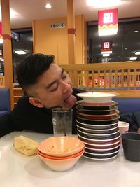Portrait of man sitting at table