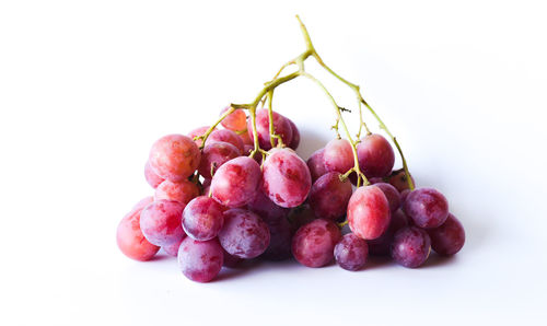 Close-up of grapes against white background