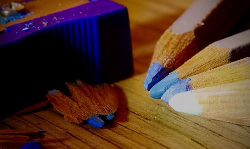 Close-up of colored pencils on table