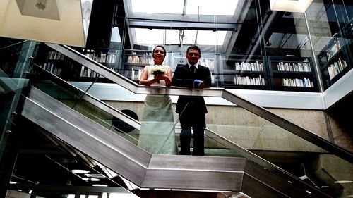 Low angle view of woman standing on steps