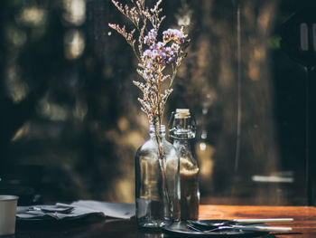 Glass vase on table at home