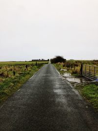 Road amidst landscape against clear sky