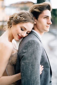 Portrait of young couple looking away