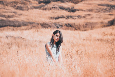 Portrait of woman on field