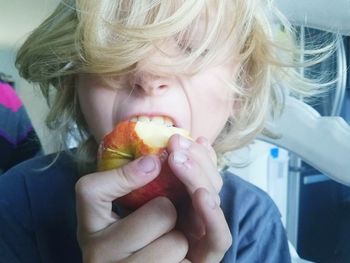 Close-up of girl eating food