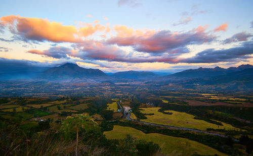 Aerial view of landscape against sky during sunset