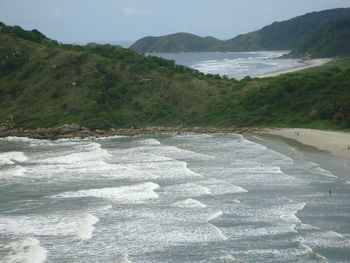 Scenic view of sea against mountains