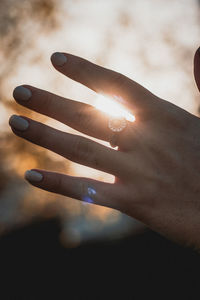 Cropped image of hand against black background