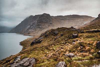 Scenic view of rocks in mountains against sky