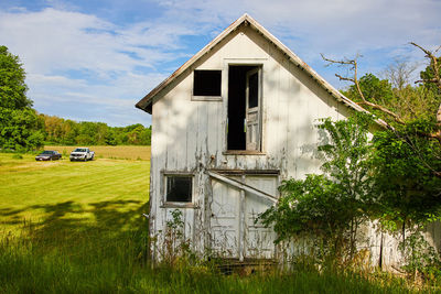 House on field against sky