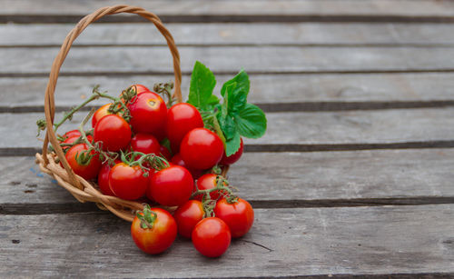 High angle view of tomatoes in basket on table