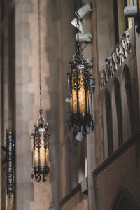 Low angle view of illuminated gothic style chandelier