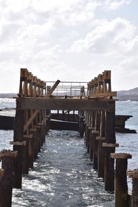 Pier over sea against sky