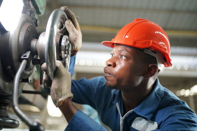 Close-up of man working in factory