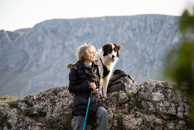 Rear view of dog on rock