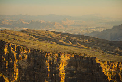 Scenic view of landscape and mountains against sky