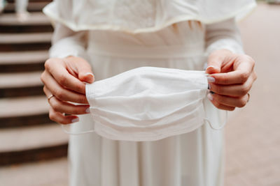 Close-up of woman holding hands