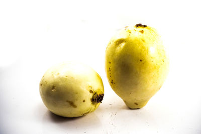 Close-up of fruits against white background