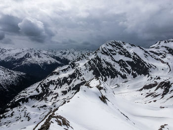 Snow covered mountains against sky