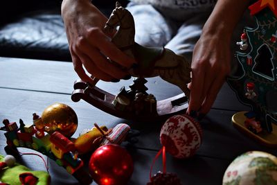 Close-up of hand holding table