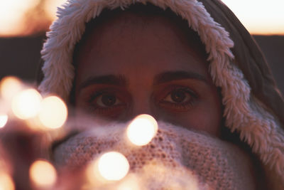 Close-up portrait of illuminated man