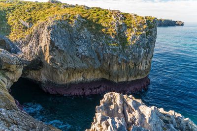 Panoramic view of rock formation in sea