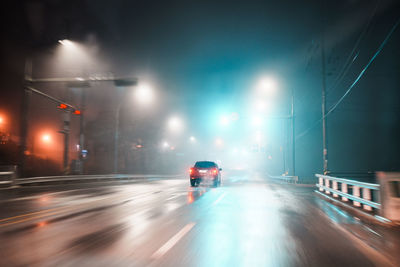 People walking on road at night