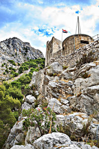 Low angle view of built structure of rock formations