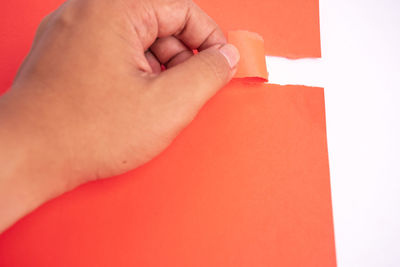 Close-up of hands over white background