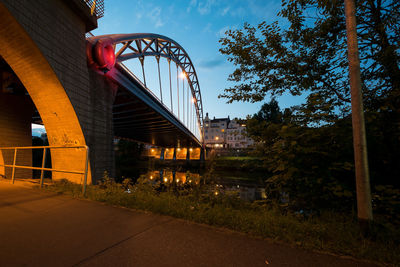 Low angle view of bridge against sky at night