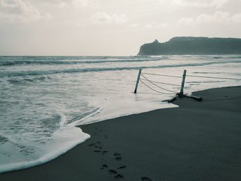 Scenic view of beach against sky