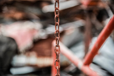 Close-up of rusty chain hanging outdoors