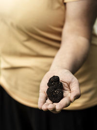 Woman holding truffles in her hand