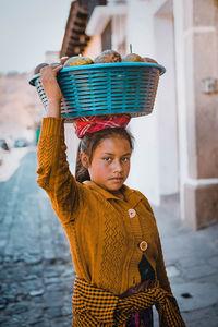 Portrait of woman selling fruit outdoors