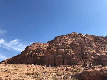 Low angle view of rock formations against sky