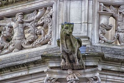 Low angle view of statue against temple