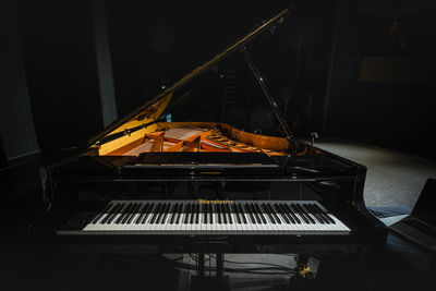 Low angle view of piano keys at home